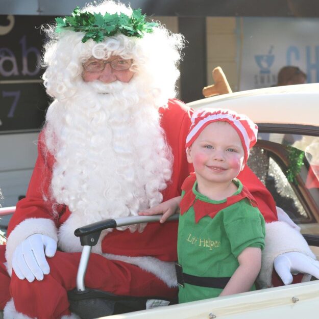 Father Christmas and his helper Ned Clark